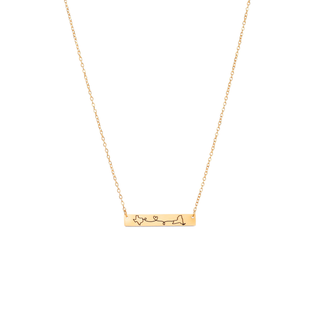 A delicate gold chain necklace featuring a horizontal bar pendant engraved with a minimalist line-art map of New York City and small heart details, shown against a solid white background.